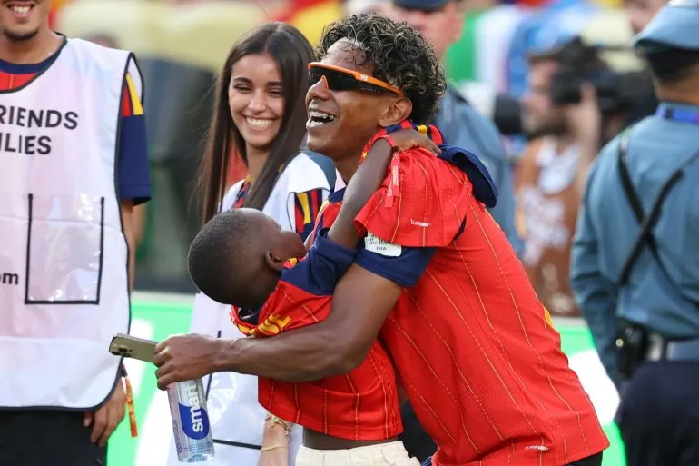 Spain's Lamine Yamal, right, embraces his brother Keyne after Spain won the World Cup final soccer match between Spain and Argentina in East Rutherford, N.J., near New York, Sunday, July 19, 2026. (AP Photo/Pamela Smith)