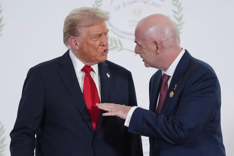 SHARM EL-SHEIKH, EGYPT - OCTOBER 13: President Donald Trump speaks with FIFA President Gianni Infantino during a world leaders' summit on ending the Gaza war on October 13, 2025 in Sharm El-Sheikh, Egypt. President Trump is in Egypt to meet with European and Middle Eastern leaders in what’s being billed as an international peace summit, following the start of a US-brokered ceasefire deal to end the war in the Gaza Strip. (Photo by Evan Vucci - Pool / Getty Images)