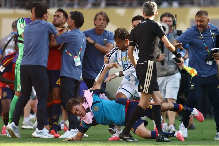 Argentina's midfielder #05 Leandro Paredes (top) clashes with Spain's midfielder #09 Gavi during the 2026 World Cup football tournament final match between Spain and Argentina at the New York/New Jersey Stadium in East Rutherford on July 19, 2026.