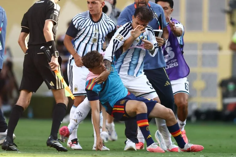 Argentina's midfielder #05 Leandro Paredes (top) clashes with Spain's midfielder #09 Gavi during the 2026 World Cup football tournament final match between Spain and Argentina at the New York/New Jersey Stadium in East Rutherford on July 19, 2026.