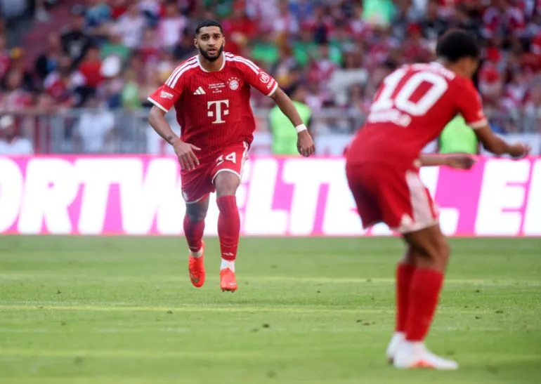 MUNICH, GERMANY - AUGUST 15: Ismael Saibari of Bayern Munich runs towards teammate Jamal Musiala who appears injured before going to ground during the Telekom Cup match between FC Bayern München and RB Leipzig at Allianz Arena on August 15, 2026 in Munich, Germany. (Photo by Alex Grimm/Getty Images)